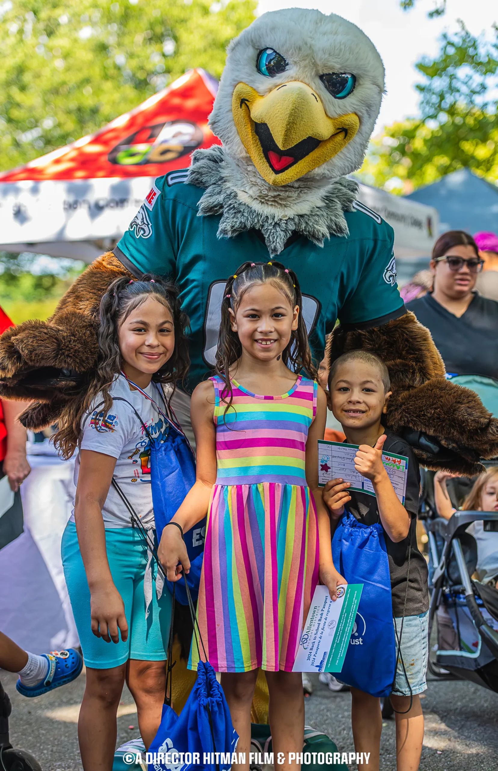 eagles swoop mascot with students at allentown back to school bash 2024