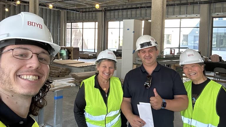 lan ma and construction crew at the site of the future paris baguette in bethlehem pa at the boyd apartment building