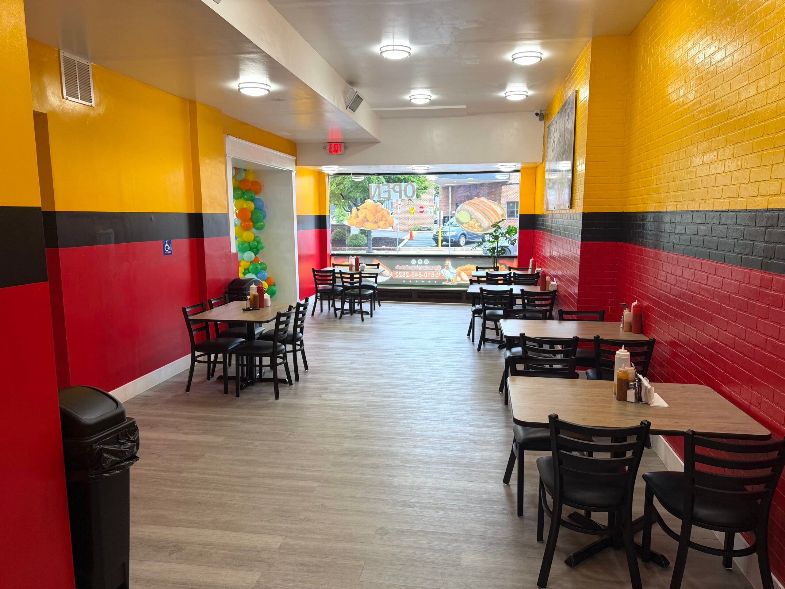 spacious dining room colored yellow, black and red at grandma chicken picapollo southside bethlehem pa may 6 2026
