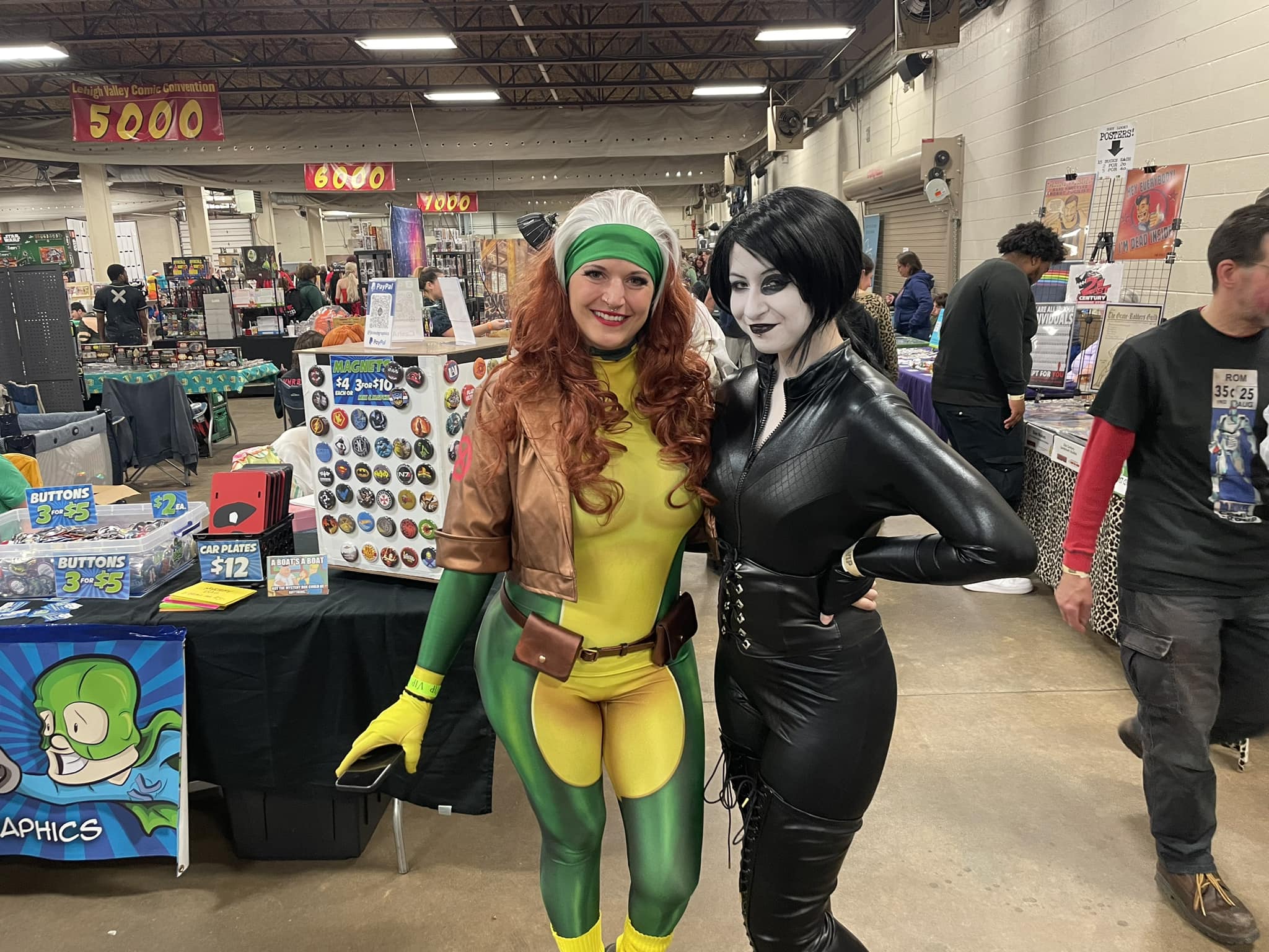 Two cosplayers pose together on the vendor floor during the Lehigh Valley Comic Convention.